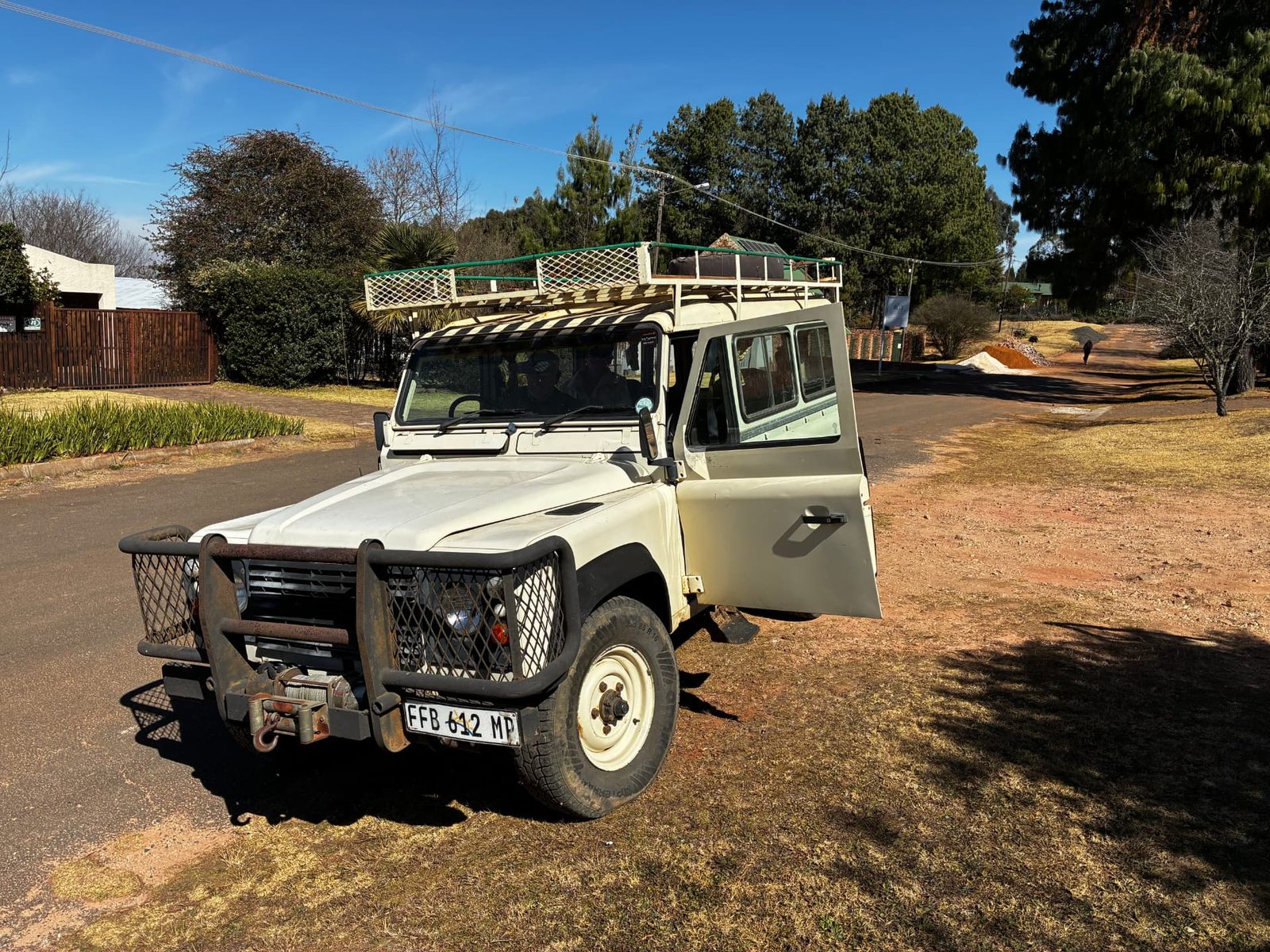 Steven's 4x4 Land Rover used for optional guest pickup, parked on a Dullstroom farm road